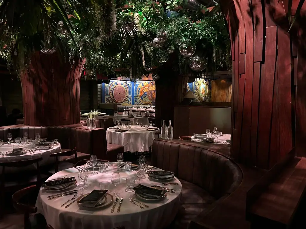 Soubois Montreal supper club interior with trees and tables