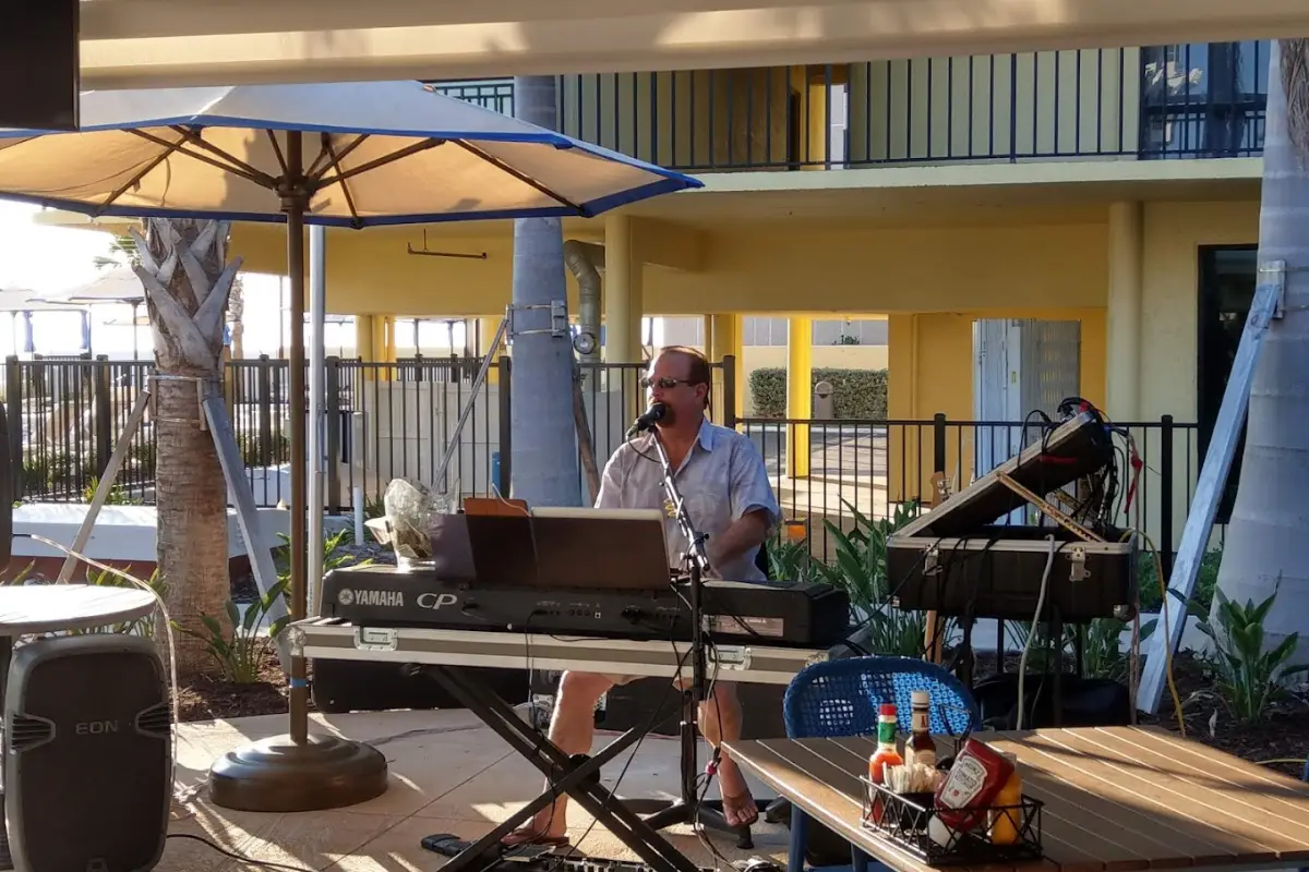 Musician playing live music in St Pete at Harry's Beach bar