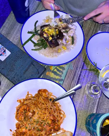 Seafood pasta and crab cakes dinner plates at Buoys Waterfront in St Pete Beach