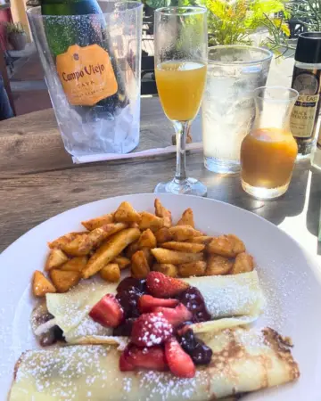 Crepes and mimosas at Chill Restaurant during brunch