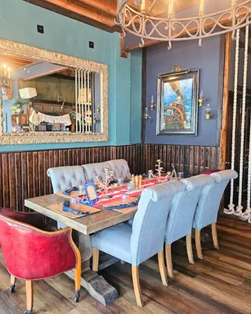 The Helm St Pete Beach elegant interior dining room with eclectic decor