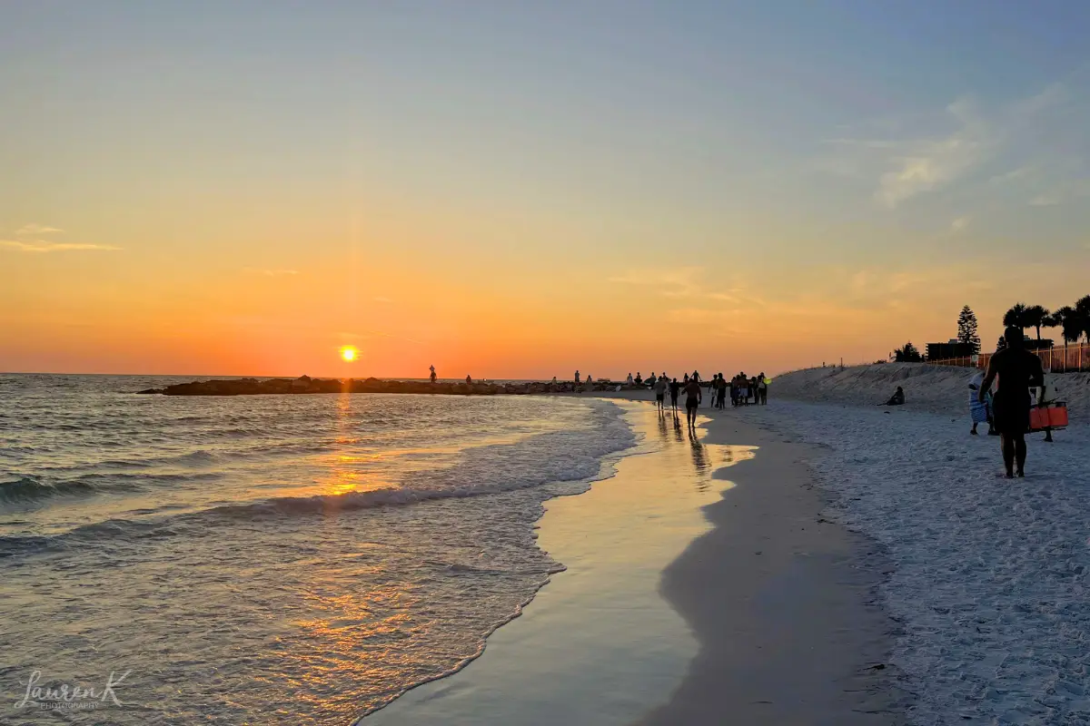 Sunset over Upham Beach Park on the north end of St Pete Beach, with people hanging out