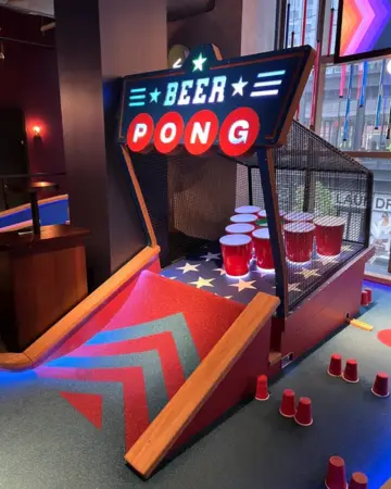 Beer pong hole at Puttshack