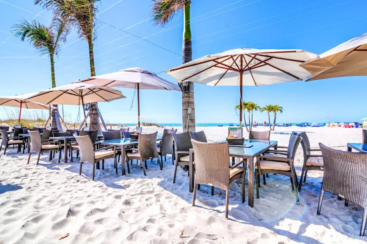 Tables and chairs in the sand at Bongo's Beach Bar on St Pete Beach