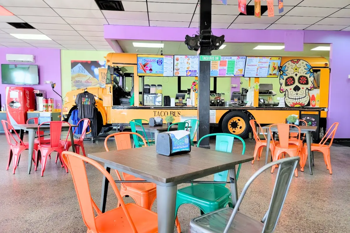 Taco Bus's interior in Treasure Island which includes an old school bus at the cash registers and colorful decor