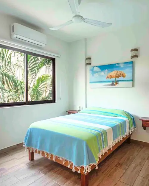 A bedroom in one of the suites at El Nopal, Oasis Surf Camp's newest hotel