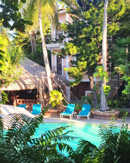 The tropical pool and garden oasis at Hotel Santa Fe, which is a hotel nearly everyone will checking where to stay in Puerto Escondido