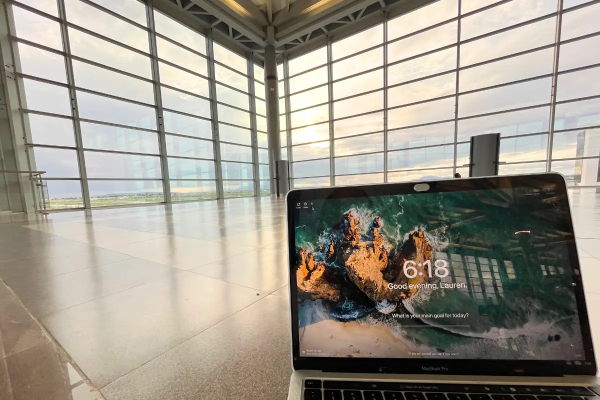 POV view of someone sitting on the floor at NLU airport with their laptop, with no one around to show that it's a huge airport