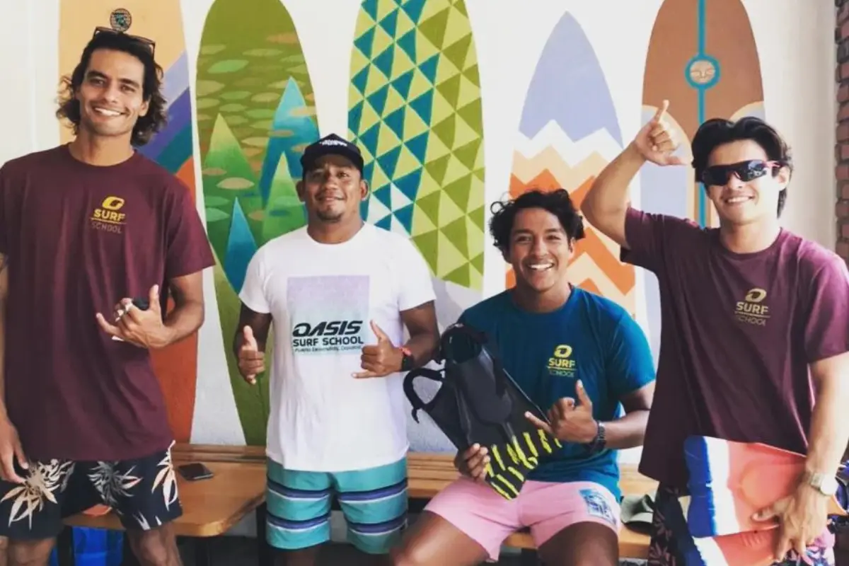 Instructors smiling at the camera at Oasis Surf Camp in Puerto Escondido, to show their pride for their jobs