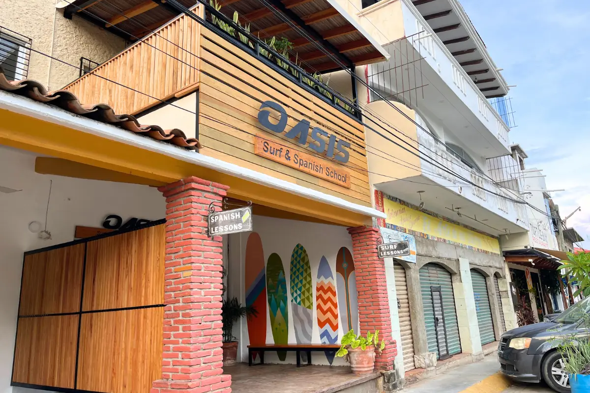 The outside of Oasis Surf Camp and entrance sign, which is one of the best places for surf lessons Puerto Escondido