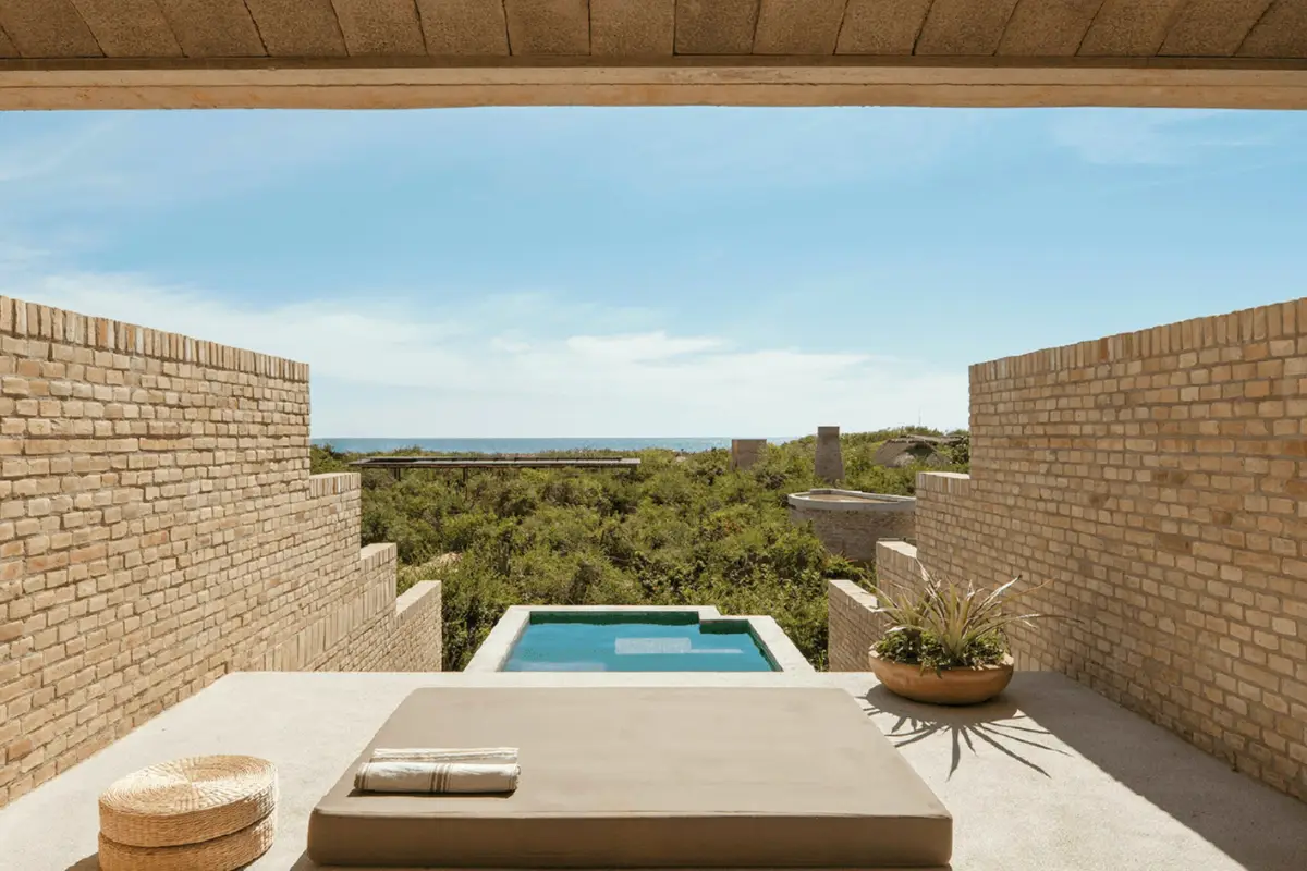 Private pool suite at Hotel Terrestre, looking out over the trees and ocean in the distance