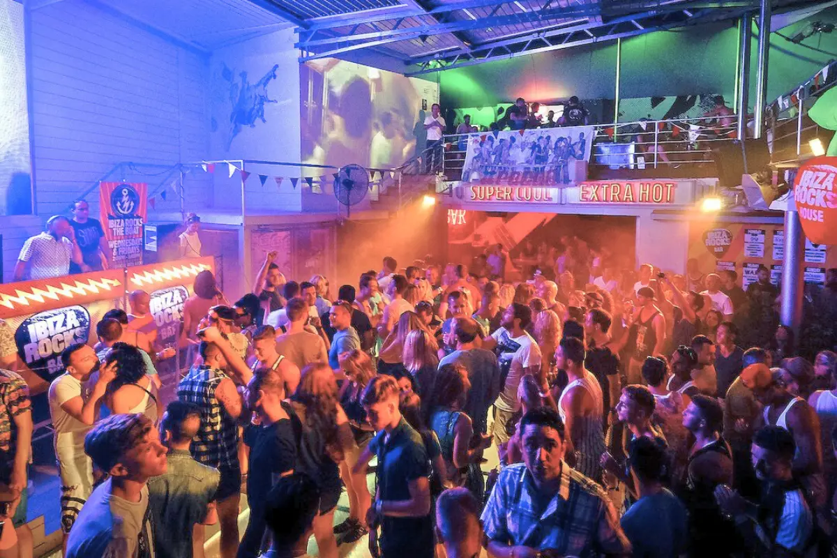 Ibiza Rocks bar, with a crowded dance floor and neon lights