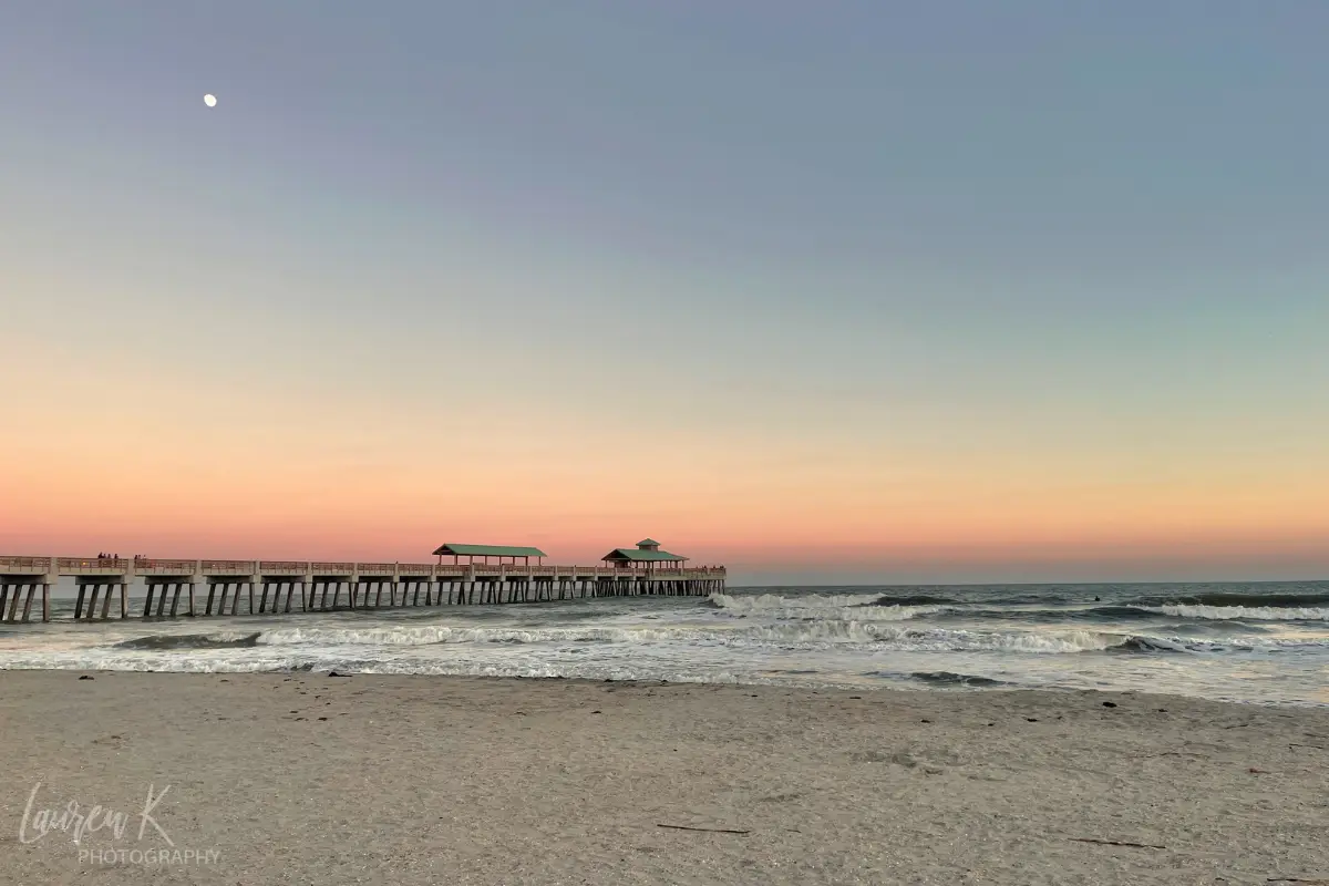 Sunset at the Folly Beach pier with the moon in the sky, image by Laurel Kessel photography