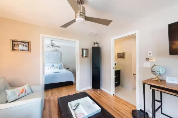 One bedroom suite in an Airbnb in West Ashley with a living room area, TV and separate bedroom