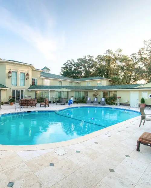 Pool in the evening time at the Town & Country Inn and Suites, showing that it's a great choice for a moderate priced stay  