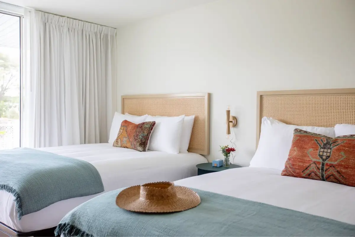 A neat and tidy two double bed room with boho chic decor at the Starlight Motor Inn