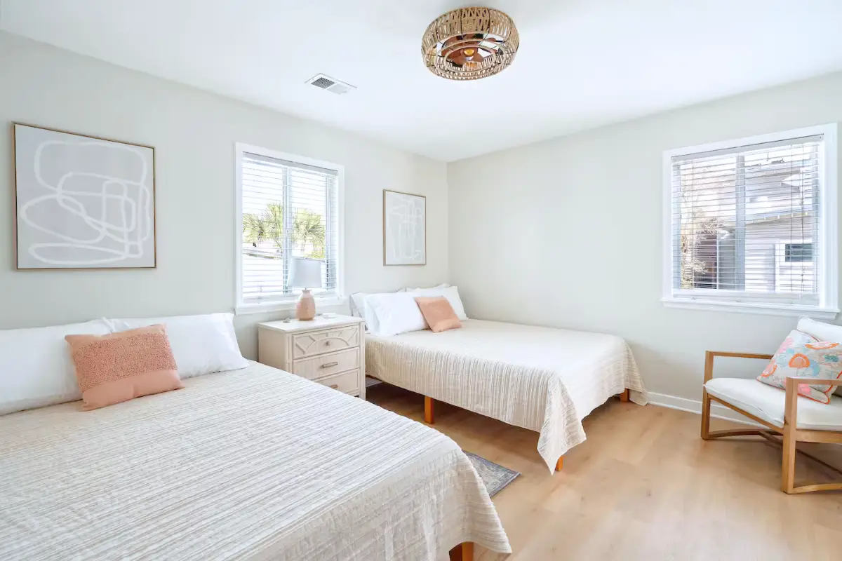 Basic, bright two queen room in a Folly Beach Airbnb with boho design