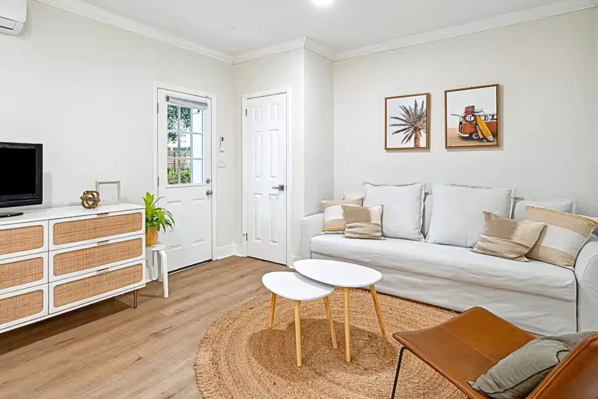 Nicely decorated, cozy living room space in an Airbnb with boho decor 