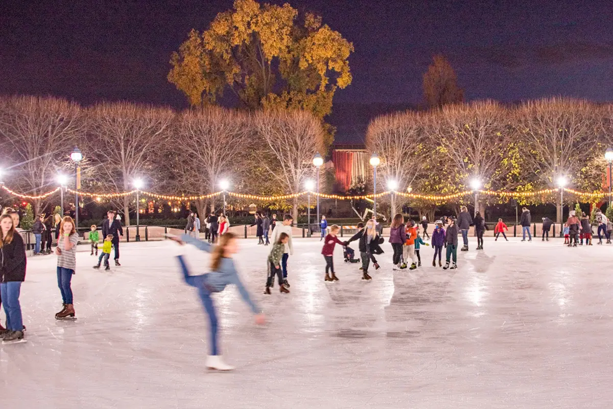 People skating at the Sculpture Garden at the National Gallery of Art, which is one of the best downtown Washington DC Christmas events to attend