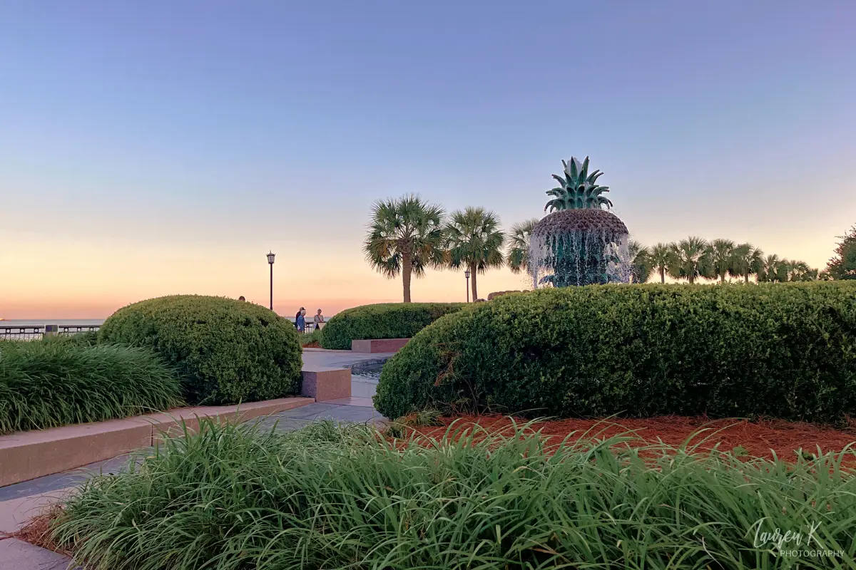 Pineapple fountain and waterfront park at sunset, which is an important place on the map of hotels in Charleston SC since it's one of the most popular places to stay