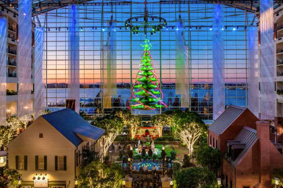 The hanging Christmas tree and decorations of the huge atrium at the Gaylord National Harbor during sunset