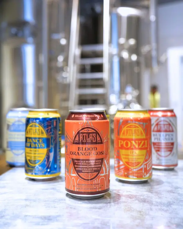 5 can of Atlas Brewery's best beers lined up, to show a sample of what they offer