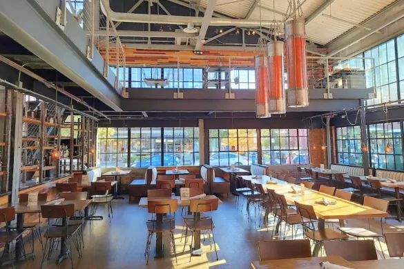 An empty, large indoor dining space at Bluejacket with high ceilings