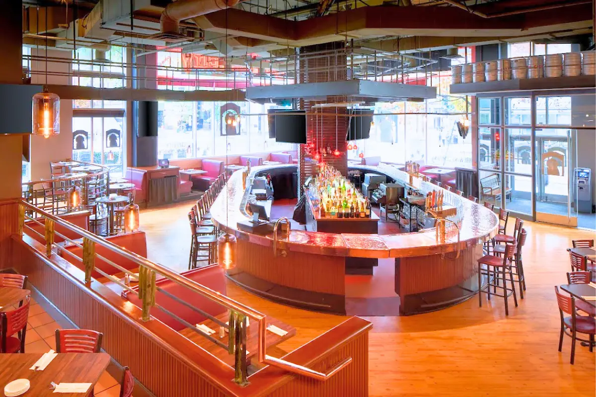 Empty, large indoor dining space and bar at Capitol City Brewing