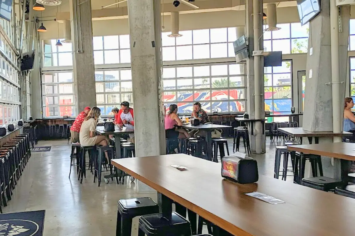 People sitting down and hanging out at Solace Brewing's indoor taproom in Navy Yard, which is one of the best Washington DC breweries