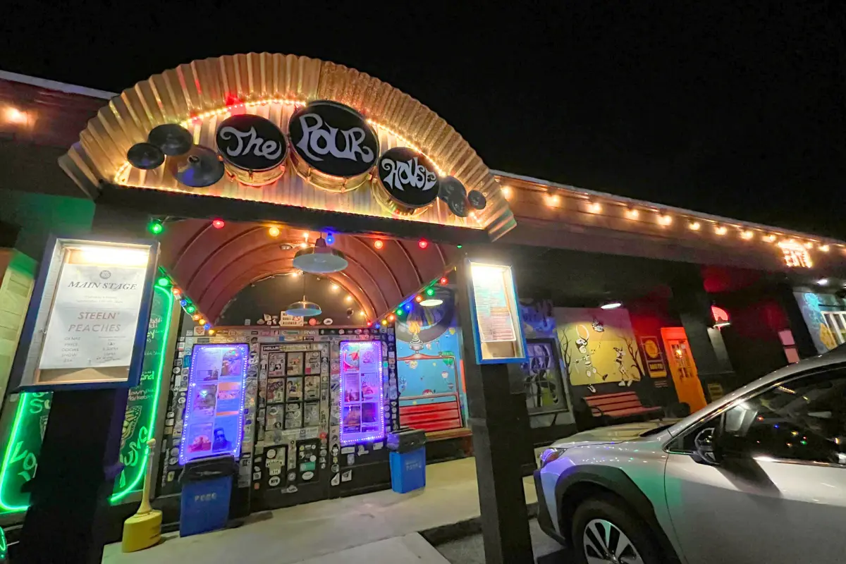 Charleston Pour House Charleston SC’s exterior and front sign at night time