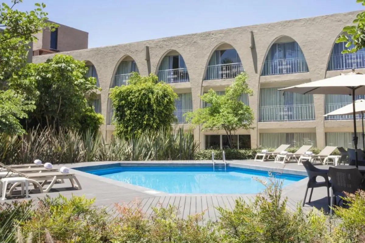 A sunny and clean pool and courtyard area at the Fiesta Inn