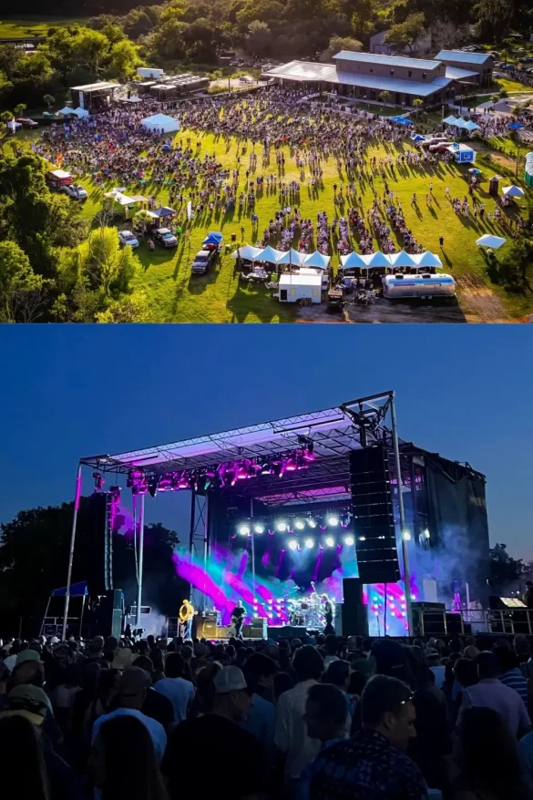 A large field with people gathered around a stage at Firefly Distillery, and the stage lit up at night with a band playing and big speakers, showing that Firefly is one of the best outdoor venues for live music Charleston SC