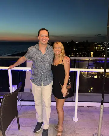 The author, Lauren Kessel and her husband at Spinners Rooftop Bar dressed up