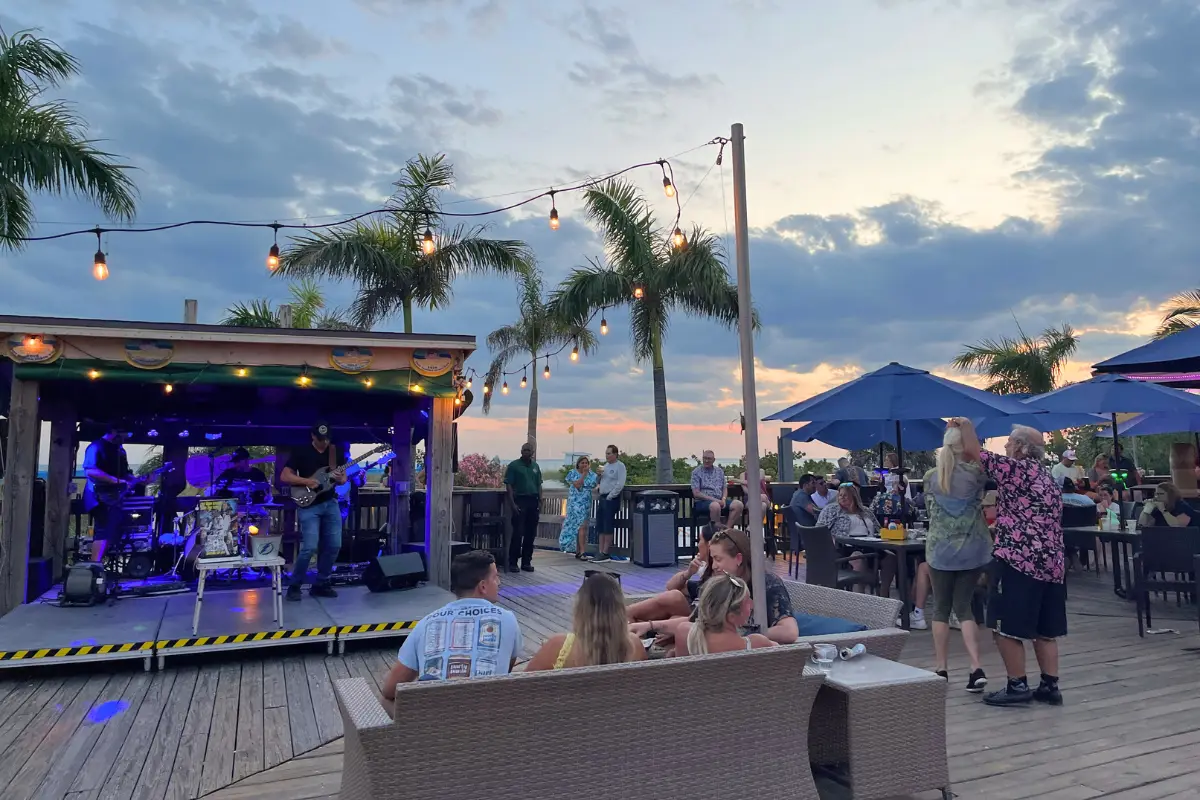 Jimmy B's St Pete Beach Bar, with a band playing and people dancing at sunset