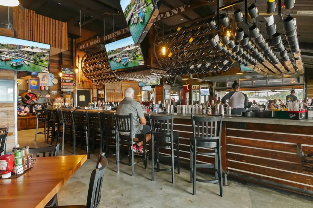One man sitting at the bar at Sea Dog Brewing Company, which is one of the best bars in the St Pete Beach area